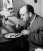 Alfred Hitchcock (1940) - Photograph of Alfred Hitchcock eating chops, taken in 1940.