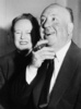 Alfred and Alma Hitchcock (1956) - Photograph of Alma Reville and Alfred Hitchcock, taken aboard the Cunard Line's RMS Queen Elizabeth which had just docked at Southampton from New York. The couple were embarking on a research trip for ''Flamingo Feather''.