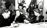 Suspicion (1941) - on set - On set photograph of the director and cast playing Scrabble.