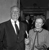 Alfred Hitchcock (1959) - Photograph of Alfred Hitchcock and Alma Reville, taken at London Airport in October 1959. The couple are in London to attend the UK premire of ''North by Northwest'' at the Empire Theatre, Leicester Square.