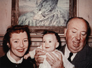 Alfred Hitchcock (1953) - Photograph of Hitchcock holding his first granddaughter, Mary Stone|Mary, in 1953.